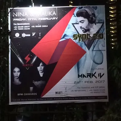 A large outdoor billboard advertising my "Sync 2.0" event. This shows the scale of promotion for my headlining gigs.