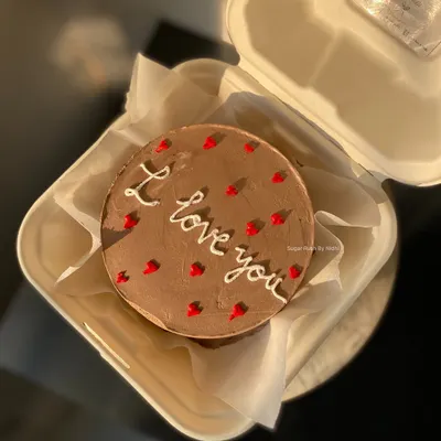 A simple and sweet chocolate truffle bento cake with an "I love you" message, perfect for an anniversary or just because.
