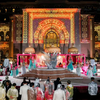 A sangeet night where the entire facade of a palace became the stage. I used projection mapping to create a dynamic, colorful backdrop for the performances, turning the architecture into a living part of the celebration.