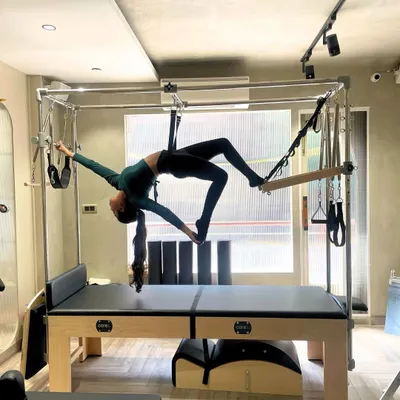 Pilates is a work of art on the Cadillac. This advanced hanging exercise demonstrates incredible core strength, flexibility, and trust in the equipment.