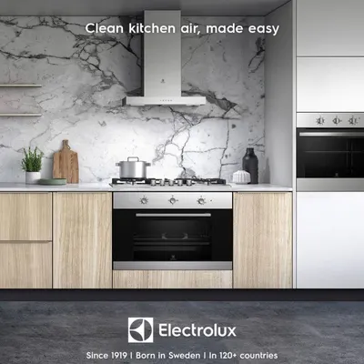 An Electrolux chimney hood integrated perfectly into a modern kitchen design. Its sleek form factor provides powerful ventilation without disrupting the clean lines of your cabinetry.