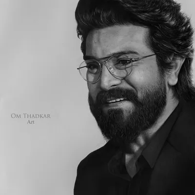 A close-up of my charcoal portrait of the actor Ramcharan. This view highlights the hyperrealistic detail in his expression, beard, and glasses, capturing his magnetic presence.