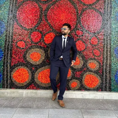 A sharp, classic two-piece suit in navy blue. This is a versatile bespoke piece, tailored for a clean fit that works for business meetings or formal events.