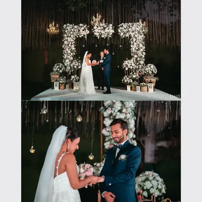 The sacred moment of exchanging rings during Gwen and Azhir's beautiful outdoor Catholic wedding.