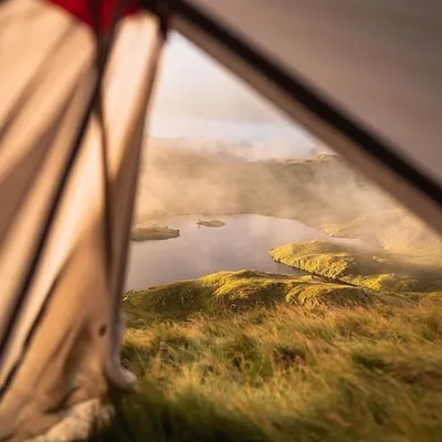 Peeking out from the tent on a misty morning to see the fog weaving through the hills and over the lake. This is the immersive experience of being right in the heart of the weather and the landscape.