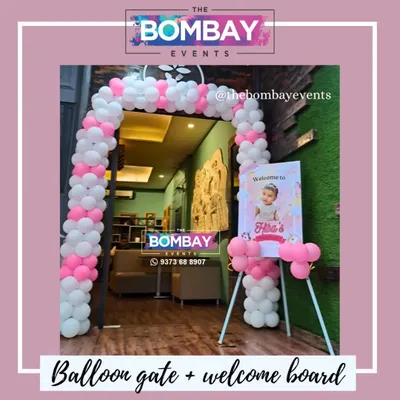 This pink and white balloon gate, complete with a welcome board, was for a first birthday. Imagine this concept adapted for a product launch, using your brand's colors to welcome guests.