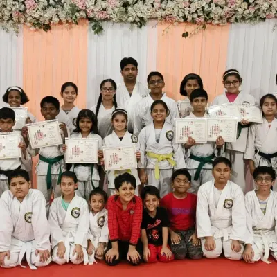 A proud moment for the entire group at our belt and certificate distribution ceremony at Rejoice International School. It's wonderful to see students of all levels, from orange to purple belts, celebrating their progress together.