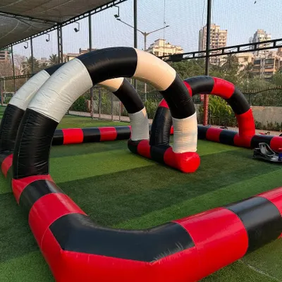 This is our full inflatable go-kart track, set up and ready for action. The defined course and soft barriers make it a safe and exciting racing environment for kids' parties.