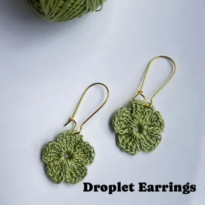 These versatile floral earrings can be worn as droplets, as seen here with elegant kidney hooks.