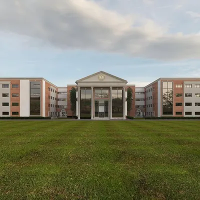 This is a look at a school facade we designed, blending classical architectural principles with modern construction. The grand columns and symmetrical design create a sense of permanence and academic prestige.