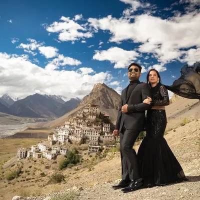 Standing together against the stunning panorama of Key Monastery in Spiti. The flowing black gown adds a touch of drama to the rugged, high-altitude desert landscape.