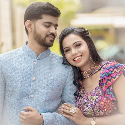 A gentle moment of comfort and affection. This classic pre-wedding portrait captures the quiet trust and love between a couple.