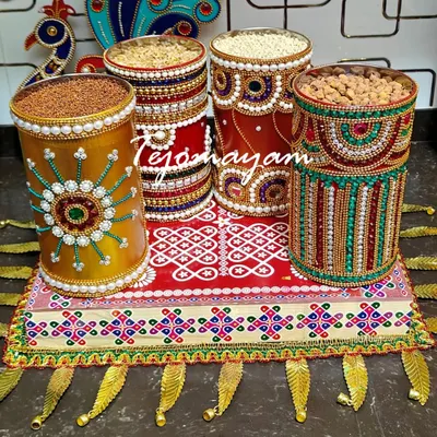 Every corner begins with a blessing. This is a traditional offering set for a housewarming ceremony, with decorated containers of grains on a hand-painted tray.