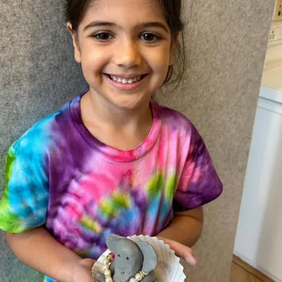 Creativity and consciousness combined! This little scientist is proudly showing off her handmade, eco-friendly Ganesha, a beautiful symbol of how art and nature can come together.