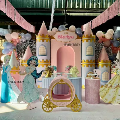A complete Disney Princess castle stage, featuring life-sized cutouts of Cinderella, Jasmine, Snow White, and Elsa, ready for a royal celebration.