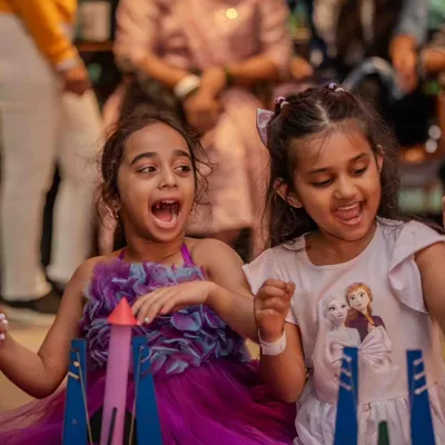 The countdown to launch! The excitement is contagious as friends get ready to test their handmade rockets together. Our parties are filled with these moments of shared discovery and friendly competition.