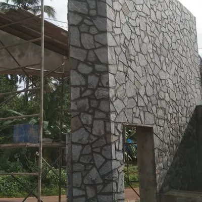 A large exterior wall covered in my random pattern wall cladding stone. This creates a massive, fortress-like appearance.