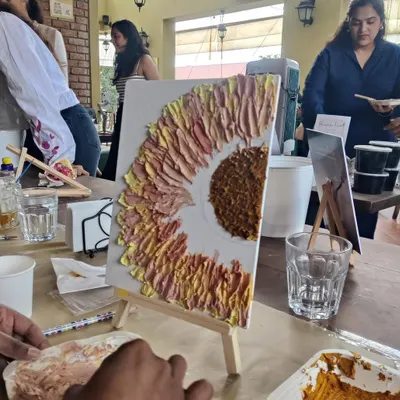 A sunflower coming to life with thick, satisfying strokes of texture paste. The beauty is in the imperfections and the bold textures.