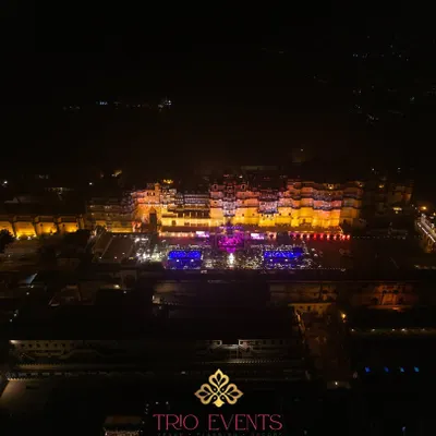 A stunning drone shot showcasing the sheer scale and grandeur of the City Palace complex in Udaipur during a wedding celebration. I have extensive experience managing events at this premier heritage venue.