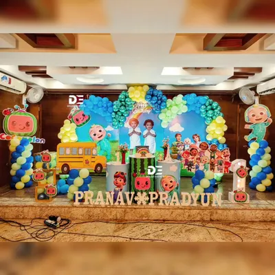 A fantastic Cocomelon party for twins Pranav and Pradyun. This setup features the iconic school bus, JJ, and all their friends, with a bright and colorful balloon arch to complete the scene.