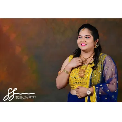 A beautiful and bright makeup look for a photoshoot with traditional Indian attire. I used a soft pink lip and defined eyes to complement the model's vibrant yellow and blue outfit.