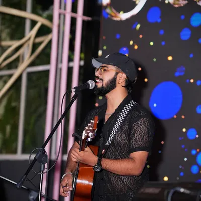 A candid shot from a live performance, capturing a moment of connection with the music. This is the focus and passion I bring to every show, big or small.