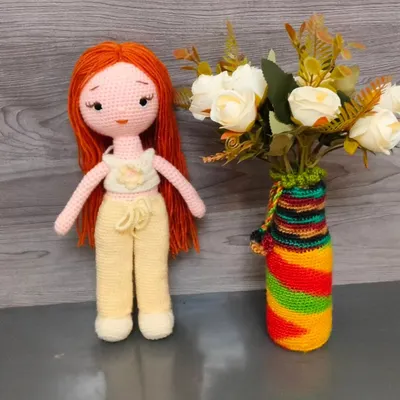 This is a beautiful crochet doll I made with long red hair. Her top and pants can be removed, which makes her fun for children to play with.