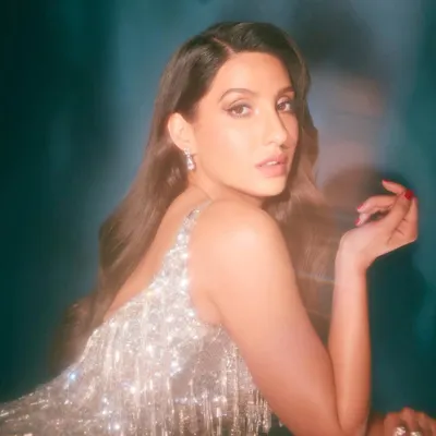 I styled Nora Fatehi in this sparkling retro tassel dress from Falguni Shane Peacock. It's a fun, glamorous party look that's all about movement and shine, perfect for a high-energy event or photoshoot.