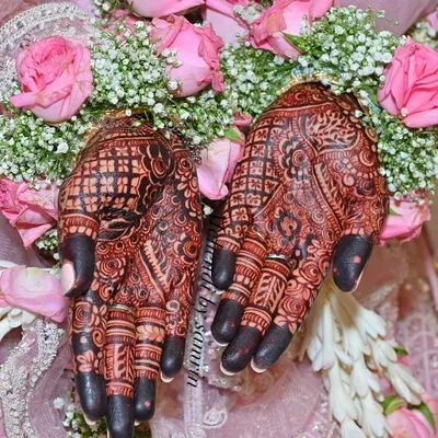 The perfect rich maroon stain against a backdrop of fresh flowers. This is the result of my organic henna and proper aftercare.