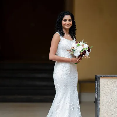 I love working with natural curls. For this bride, I created a soft, romantic hairstyle that enhanced her beautiful texture, paired with glowing, minimal makeup.
