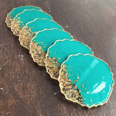 A set of stunning teal and gold resin coasters. I'll teach you how to create this geode-inspired look with a beautiful gold leaf edge.