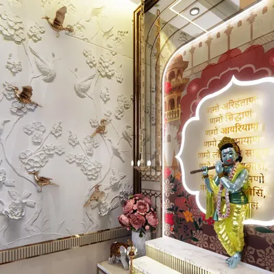 We capture the essence of spirituality in every detail. This pooja corner features a beautiful idol of Krishna set against a custom backlit panel, complemented by a stunning 3D wall mural of birds and flowers.