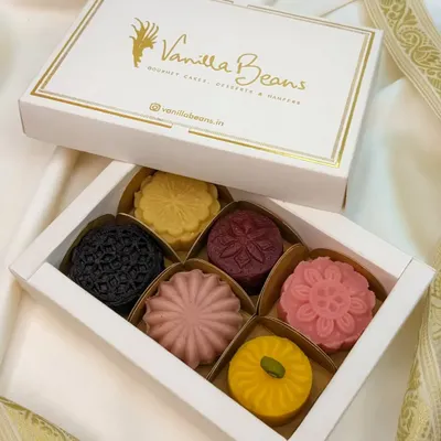 Our assorted Cake Mithai box, showcasing the intricate designs and vibrant colors of our fusion desserts. A perfect gift for Diwali or any celebration.