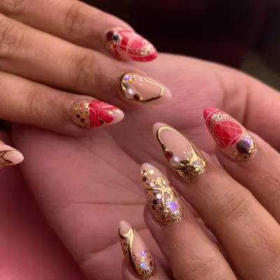 The ultimate bridal nail fantasy. This intricate set features red and gold accents, delicate patterns, and 3D elements for a truly luxurious and unforgettable wedding day look. Every detail is handcrafted for the perfect bridal manicure.