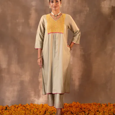 The Ruhani Sage Green A-Line Kurta, shown here in its full length. Crafted in a rich cotton-silk blend with Pakka hand embroidery, it offers a balance of comfort and quiet sophistication, complete with side pockets for practicality.