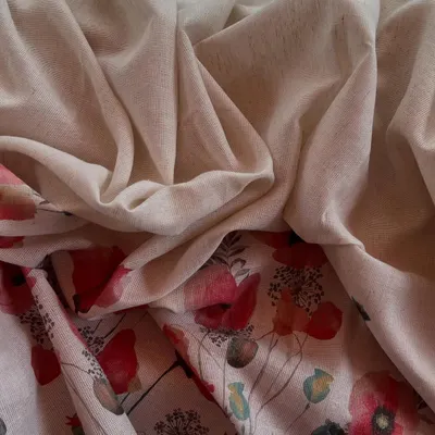 This Jute Daman printed fabric combines an earthy, natural texture with a beautiful floral print, perfect for creating unique and artistic outfits.