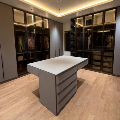 This is the foundation of a dream wardrobe. We started this project with a clean slate, designing a modern walk-in closet with a central island for accessories and sleek, glass-front cabinets. The design phase is crucial for building in organization from the very beginning.
