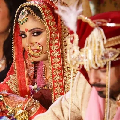 I love this candid shot of my bride during her wedding ceremony. It captures her confidence and the way her dramatic eye makeup and flawless skin look stunning on camera.