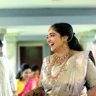 A moment of pure, spontaneous laughter from the bride. These are the candid shots we live for, capturing the real emotions and joy of the day.
