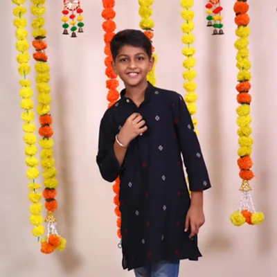 There's something so special about a boy in a kurta. This dark, handloom cotton kurta with subtle motifs is a classic piece that looks smart and feels comfortable, making him the center of attention.