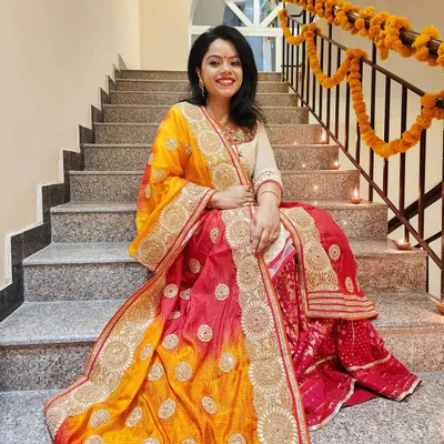 Dressed for Diwali in a stunning pink and yellow lehenga with intricate gold work. This is how you combine tradition with glamour for the festival of lights.