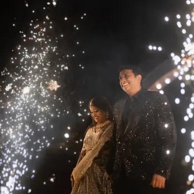 A magical end to a perfect day. I love capturing couples surrounded by the sparkle of fireworks, a truly cinematic moment that symbolizes the bright start to their new life.
