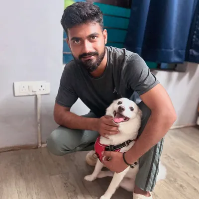 Our staff member Guddan sharing a cuddle with the birthday boy, Bunni. Our team doesn't just care for the dogs; they form genuine, loving bonds with each one.