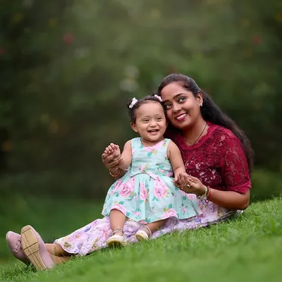 A sweet and relaxed portrait of a mother and her little girl enjoying a quiet moment together on the grass. These are the simple, beautiful memories I love to preserve.