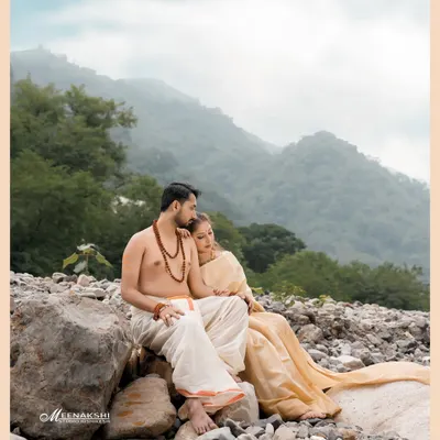 A serene pre-wedding moment for a couple on the rocky banks of the Ganga, with the misty Rishikesh hills creating a timeless backdrop. This spiritual theme is something I love to explore with couples who share a connection with the city.