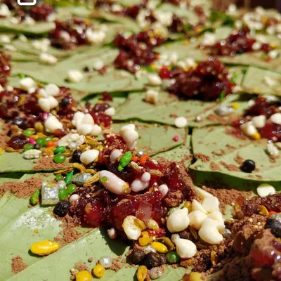 A close-up of my modern sweet paan, loaded with gulkand, colorful sprinkles, and other sweet mouth fresheners. Each paan is a burst of flavor and texture.