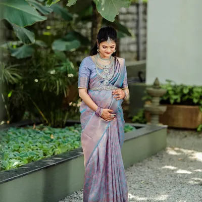A beautiful mother-to-be at her baby shower, surrounded by the lush greenery of our venue. The natural setting provides a serene and beautiful backdrop for maternity photos.