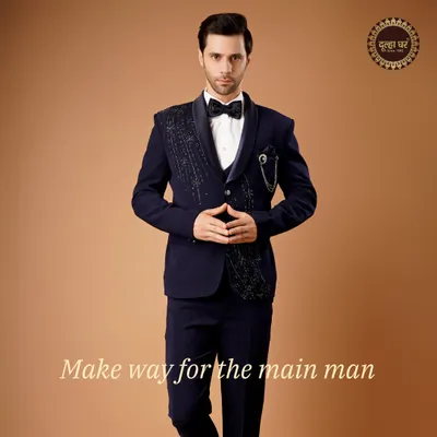 Make way for the main man. This deep navy tuxedo with an intricately embellished lapel is designed for the groom who owns the spotlight.