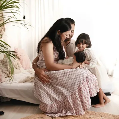 These are the beautiful memories that deserve to be captured forever. A quiet moment with mom, dad, and big sister all admiring the newest addition to their family.