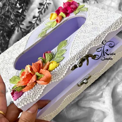 This Russian sculptured tissue box features a lavender base with delicate white filigree work. I added small bouquets of colorful pop-up flowers to make it a beautiful and useful decorative item.